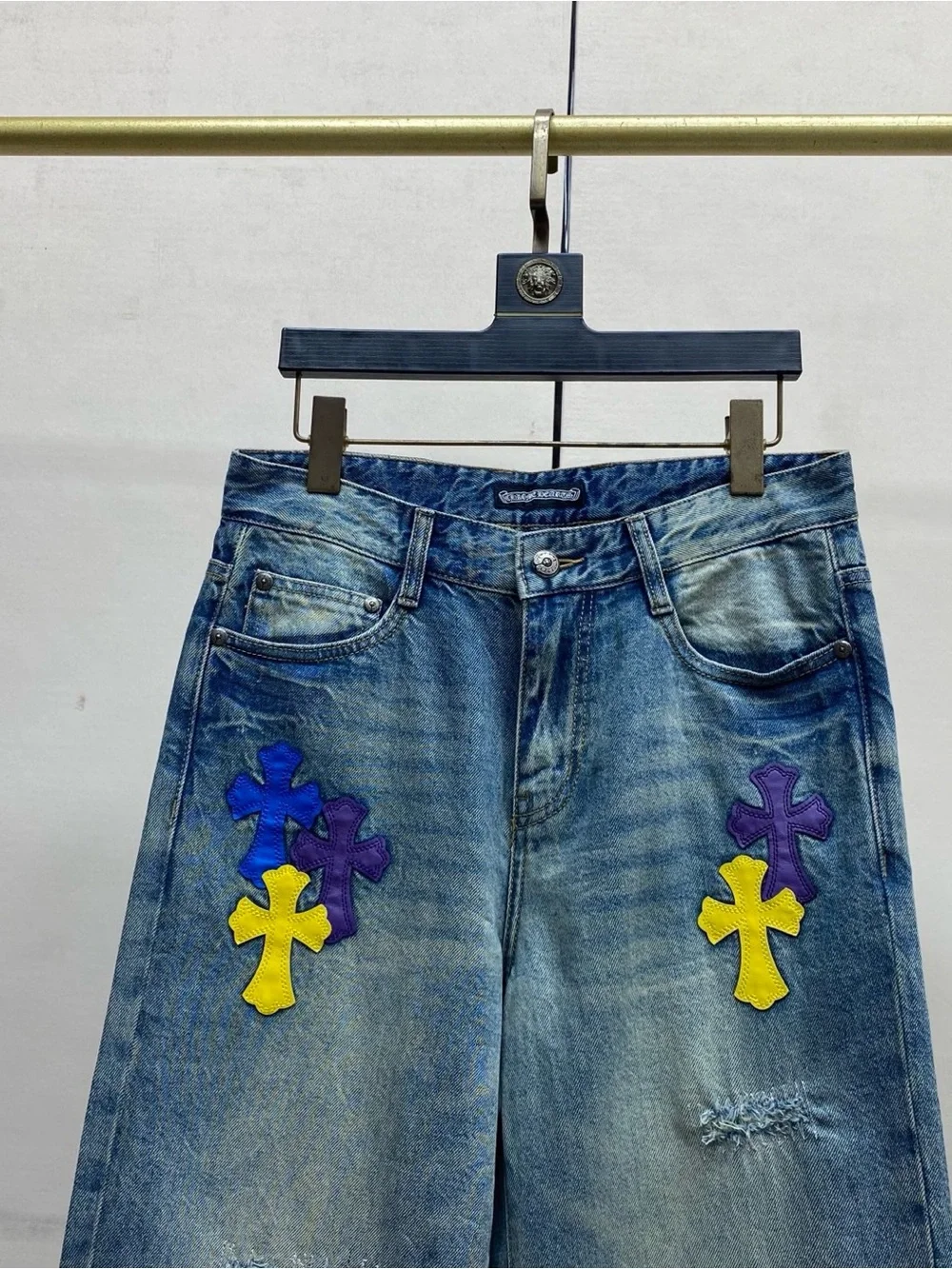 Chrome Hearts Blue Wide-Leg Jeans with Purple & Yellow Cross Appliqués
